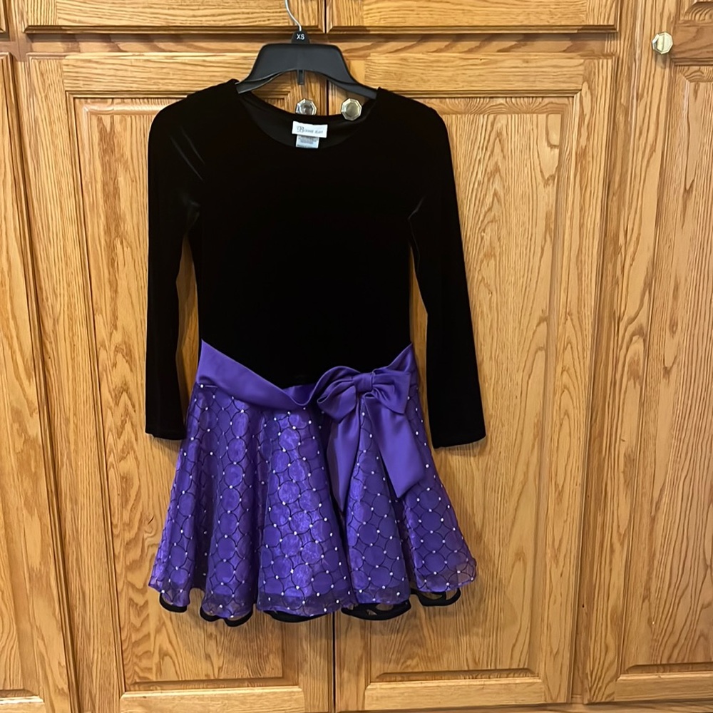 This is a formal dress with a cute bow